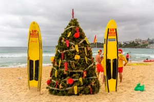 Christmas tree and surfboards on an Australian beach