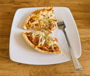 Slices of homemade pie on a plate with a fork