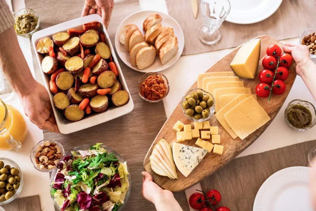A cheese plate with other selected nibbles, including nuts and bread